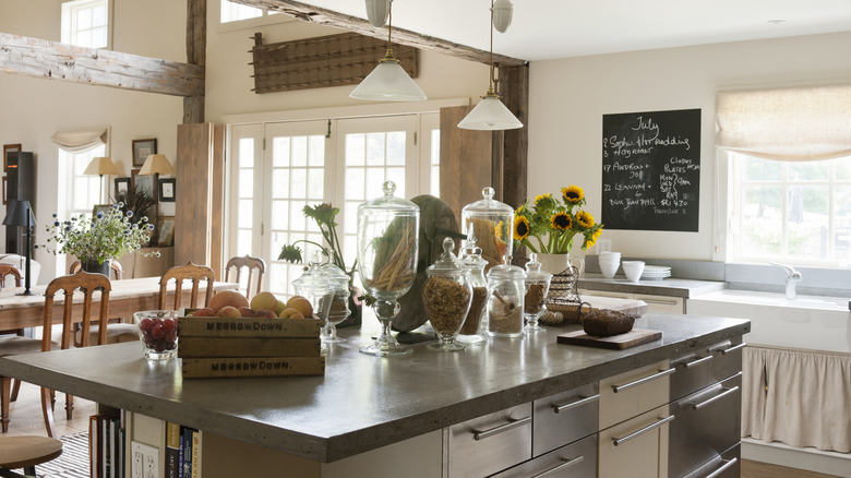 Kitchen with a concrete countertop on island.