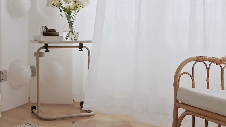 Mystic Home sheer curtains on window in front of table with flowers