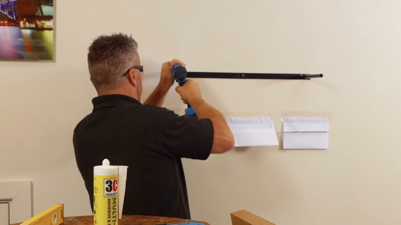 Installing floating shelf bracket