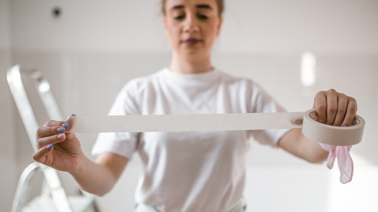 Woman with painters tape