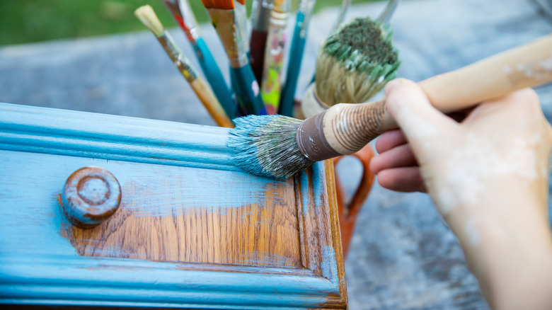 furniture being painted blue