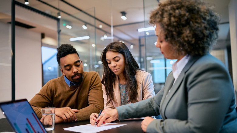 banker meeting with loan applicants