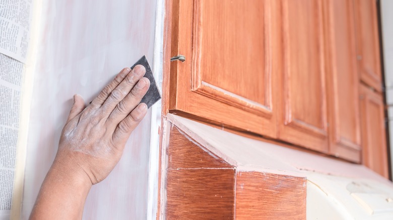 Hand sanding cabinets