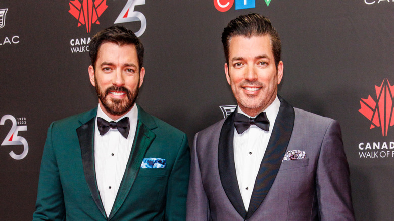 Property brothers smiling at red carpet event