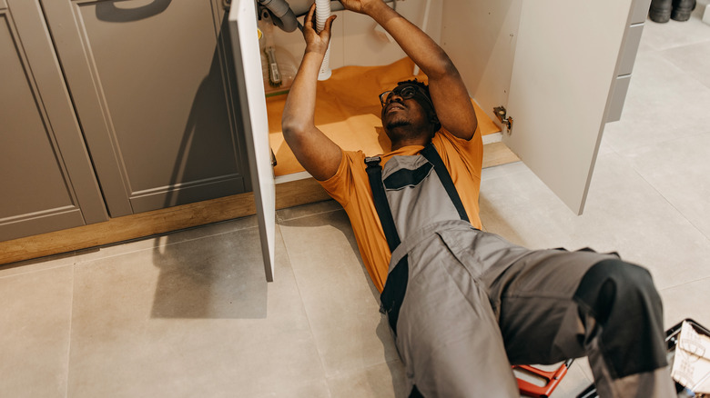 Person installing sink