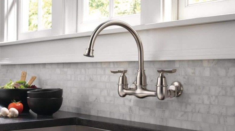 chrome wall-mounted kitchen faucet