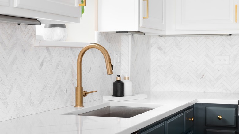 gold faucet in kitchen