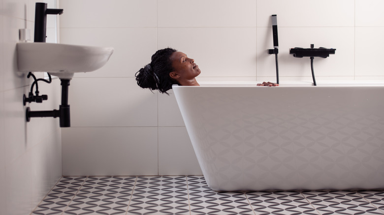 woman relaxing in bathtub