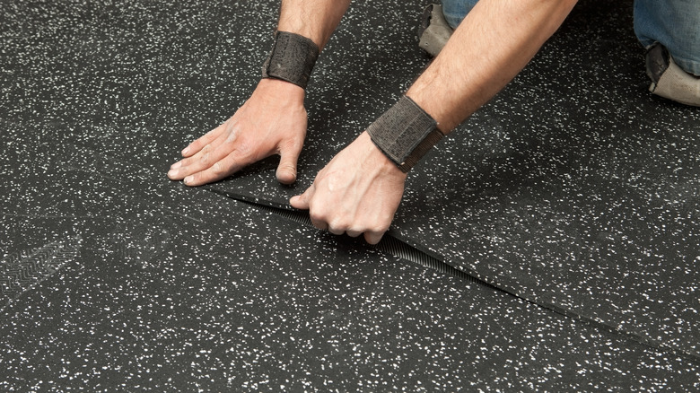 https://www.housedigest.com/img/gallery/the-pros-and-cons-of-putting-rubber-flooring-in-your-garage/intro-1697659485.jpg