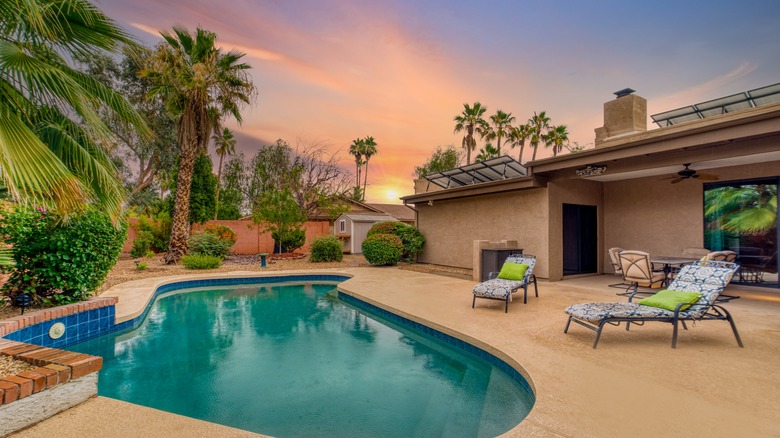 Pool home with palm trees