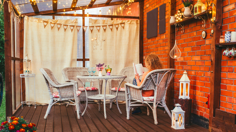 woman reading in enclosed patio