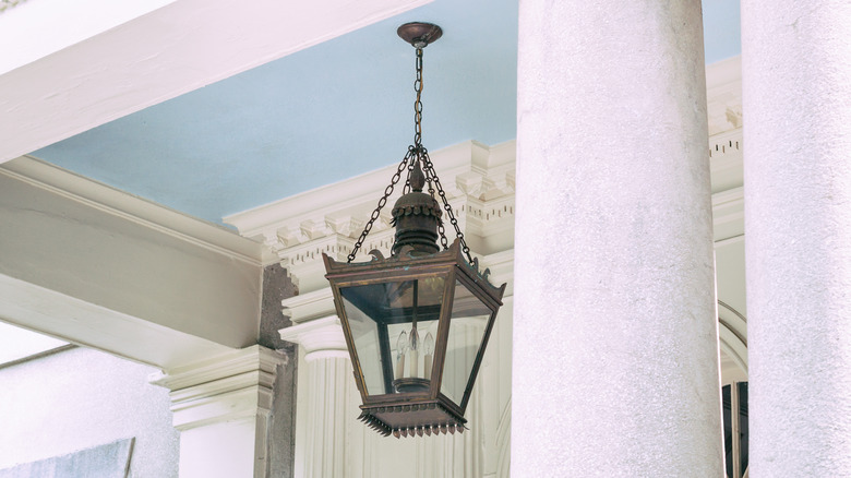 Haint blue ceiling with columns and lampshade