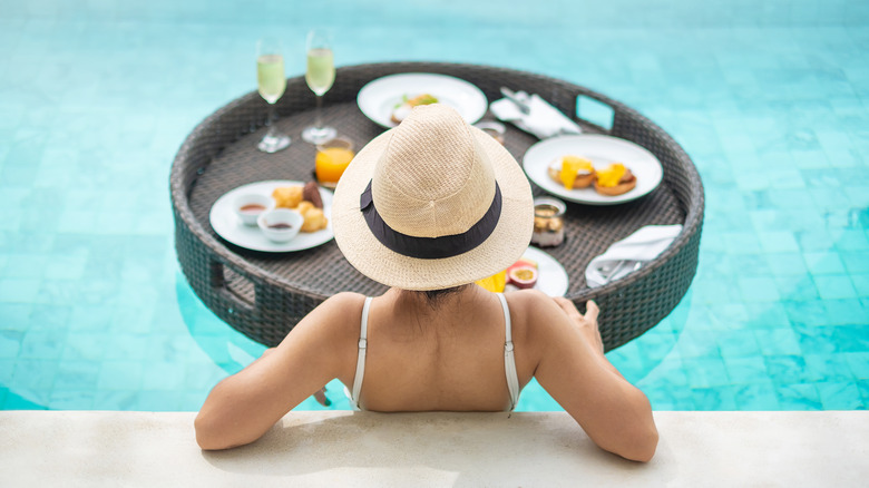 Woman relaxing poolside 