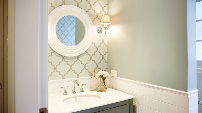 Bathroom with accent wallpaper