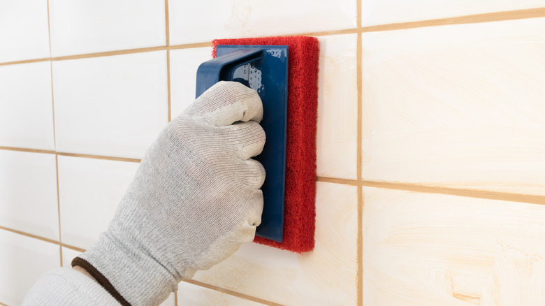 hand cleaning tiles