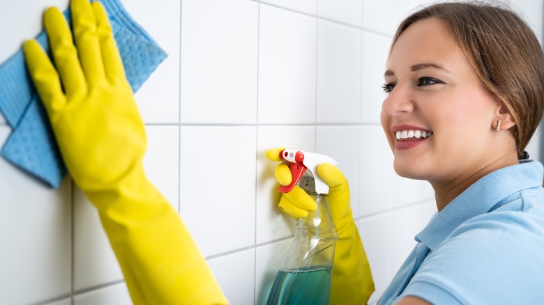 woman cleaning grout