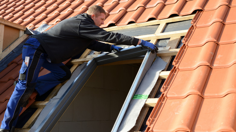 Man installing a skylight