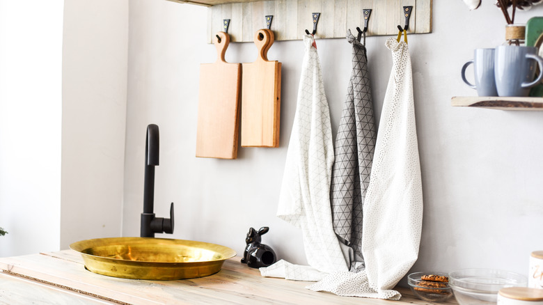 Dish towels hung on hooks