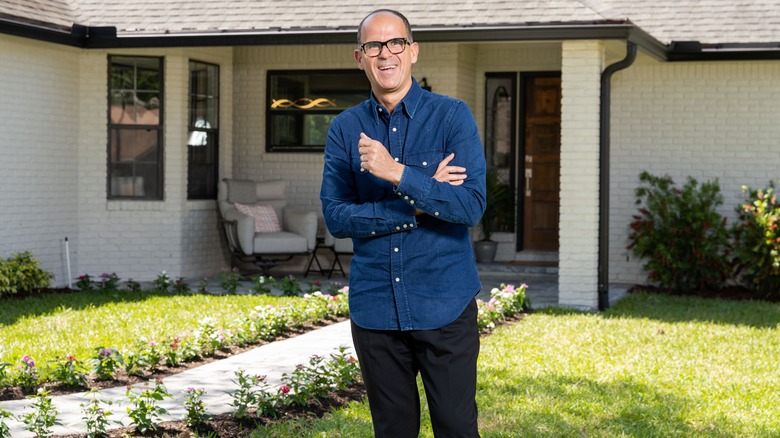 Marcus Lemonis smiling outside home