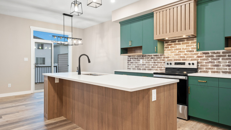 Beautiful kitchen with green cabinets