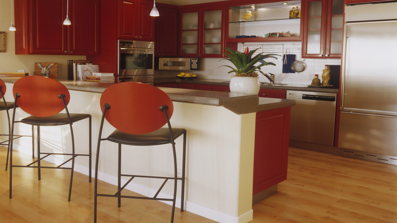 Dark red cabinets in a kitchen