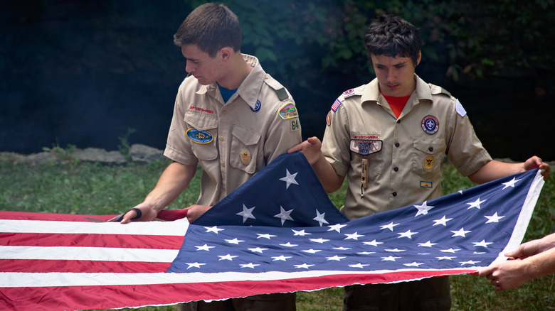 boy scouts holding American flag 