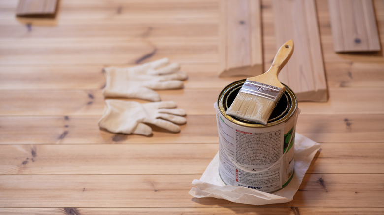 paint brush on metal bucket