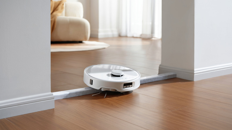 Robot vacuum traversing floor transition