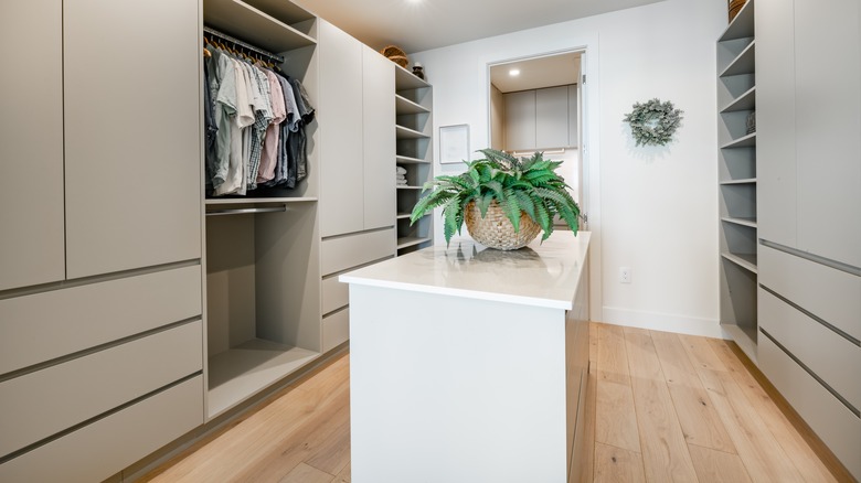 white dresser island in closet