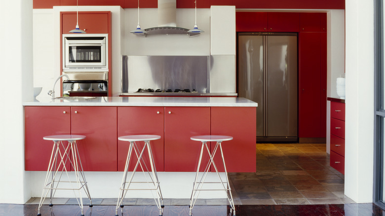 Kitchen with red cabinets