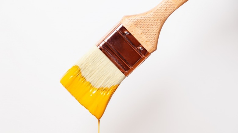 Paint dripping off brush