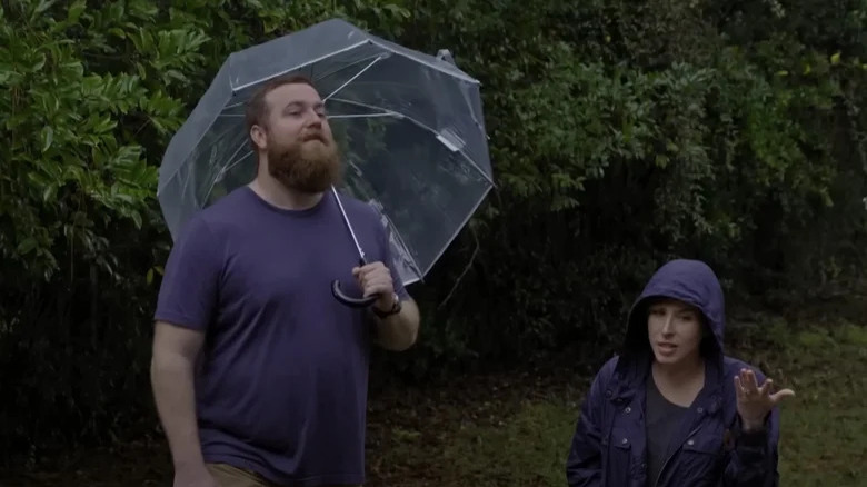 Erin and Ben Napier outside in the rain