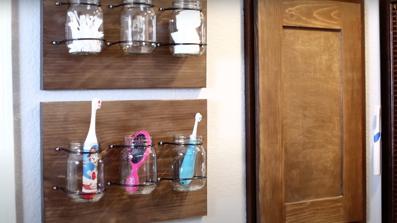 Glass jars hung up in bathroom