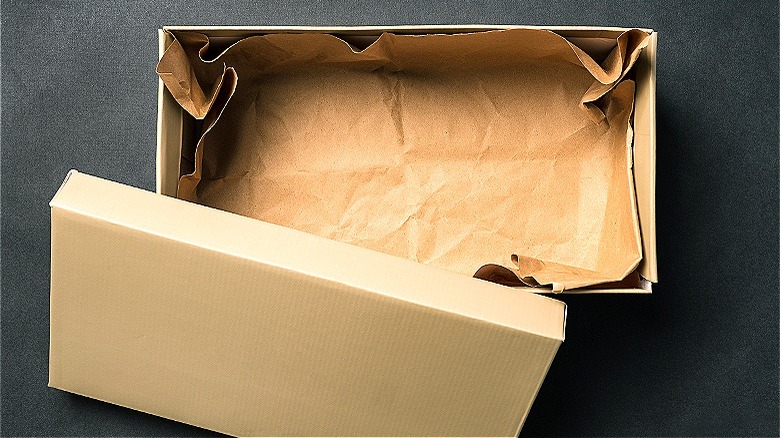 Open shoebox with paper inside