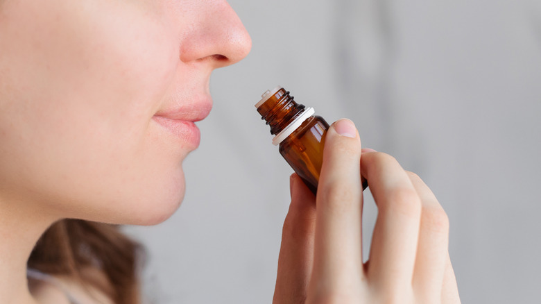 Woman smelling eucalyptus oil