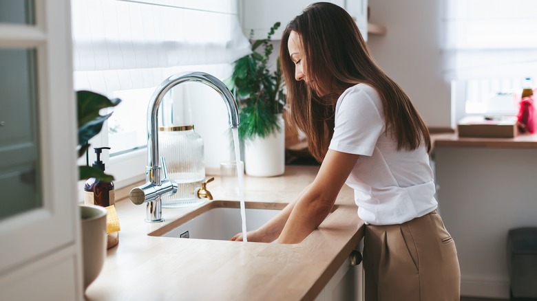 Woman washing dishes