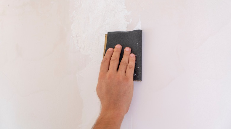 hand sanding with sand paper