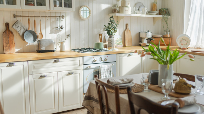 Sunlight pours into a neutral kitchen