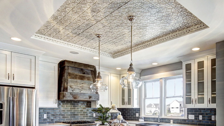 Kitchen with an inset metallic tile ceiling