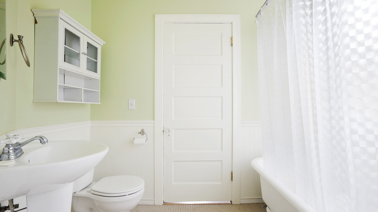 Bathroom with a plastic PVC shower curtain liner