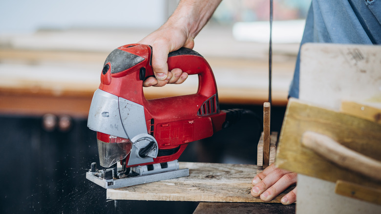 person using jig saw