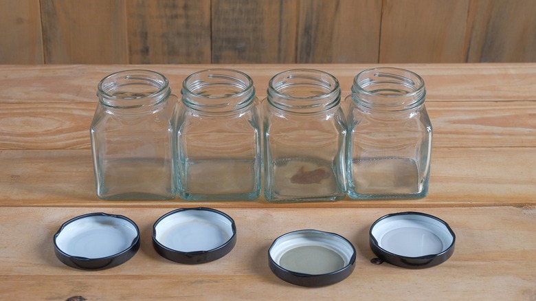 Four mason jars on table