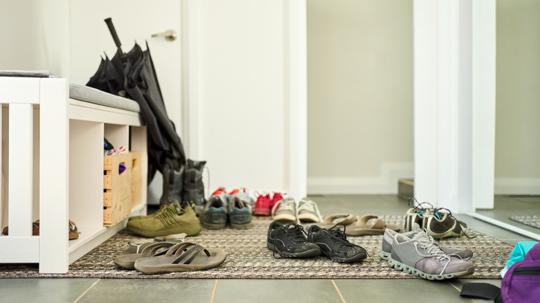 Several pairs of shoes scattered across the floor