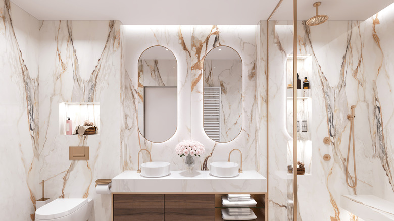 bathroom with gold hardware and decor