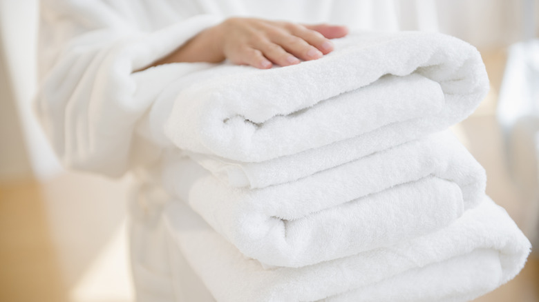 Person holding towels