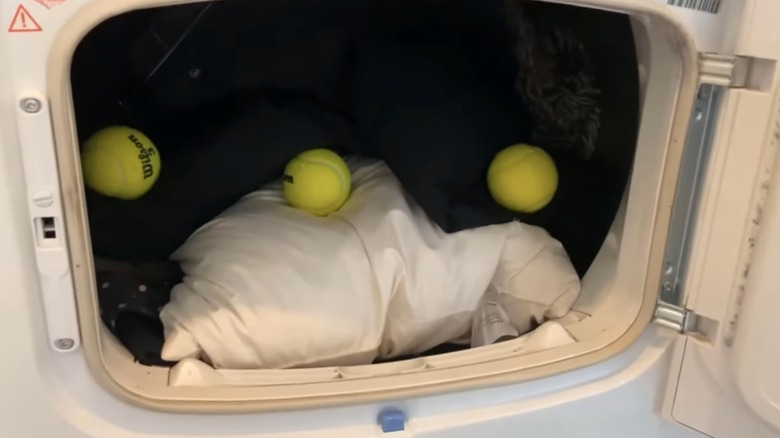 tennis ball in dryer with bedding 