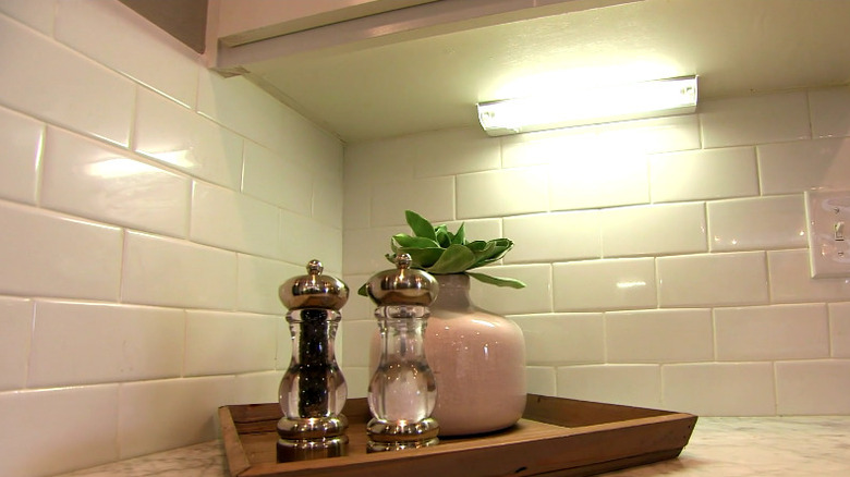 White kitchen with under cabinet lights