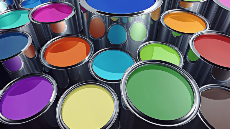 Numerous cans of colorful indoor paint