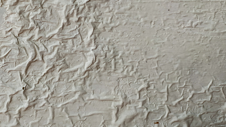 Dried, wrinkled paint on a wall