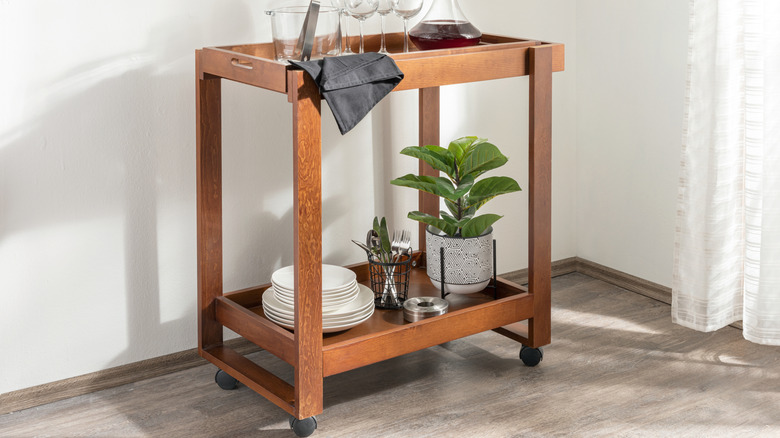 elegentally curated wooden kitchen rolling cart